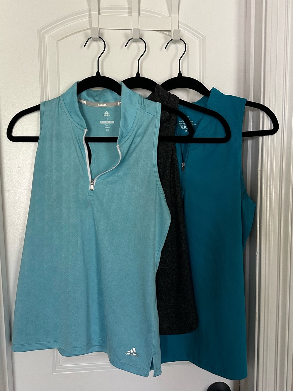 3 women’s zip golf tanks